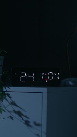 digital clock in a dark bedroom