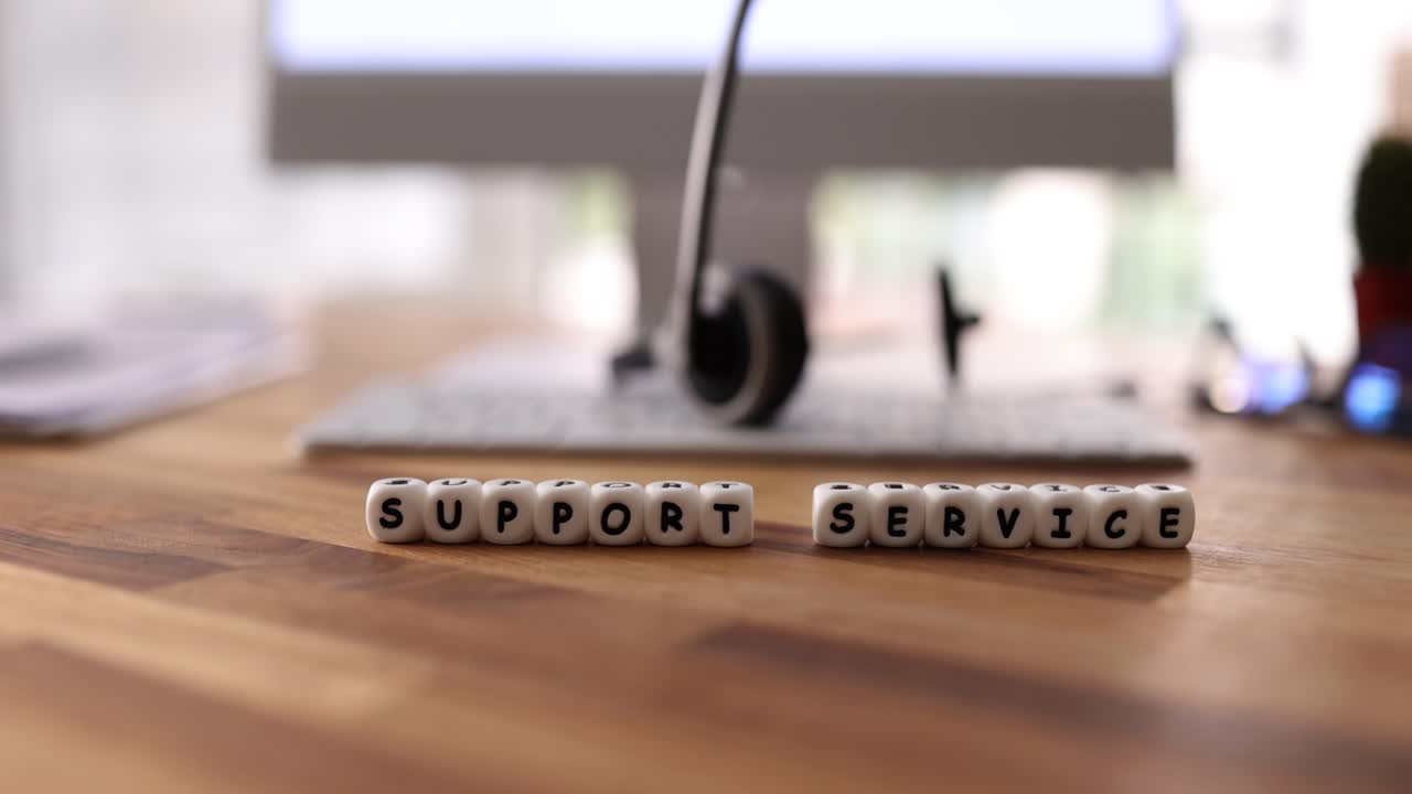 Support Service text on beads with office background