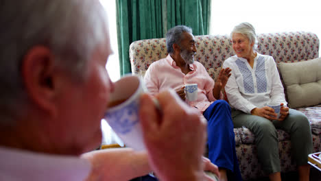close-up of active caucasian senior man drinking coffee at nursing home 4k