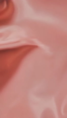 soft, flowing fabric in shades of red and pink