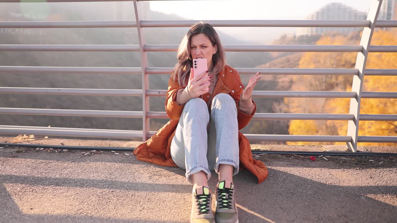 Woman on Bridge Talking on Phone