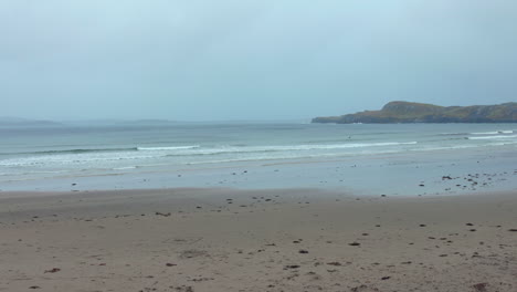 sliding shot of a sandy beach on ireland's northwestern atlantic coast