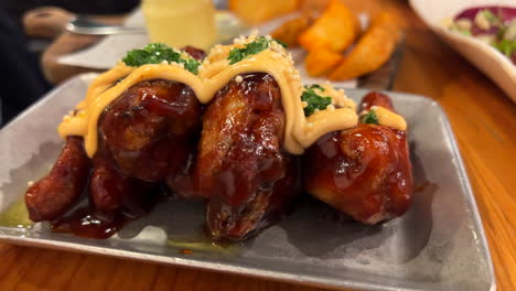 delicious barbecue chicken wings with potato wedges