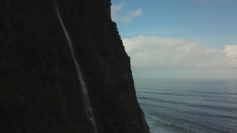 drone shot of a little waterfall in madeira