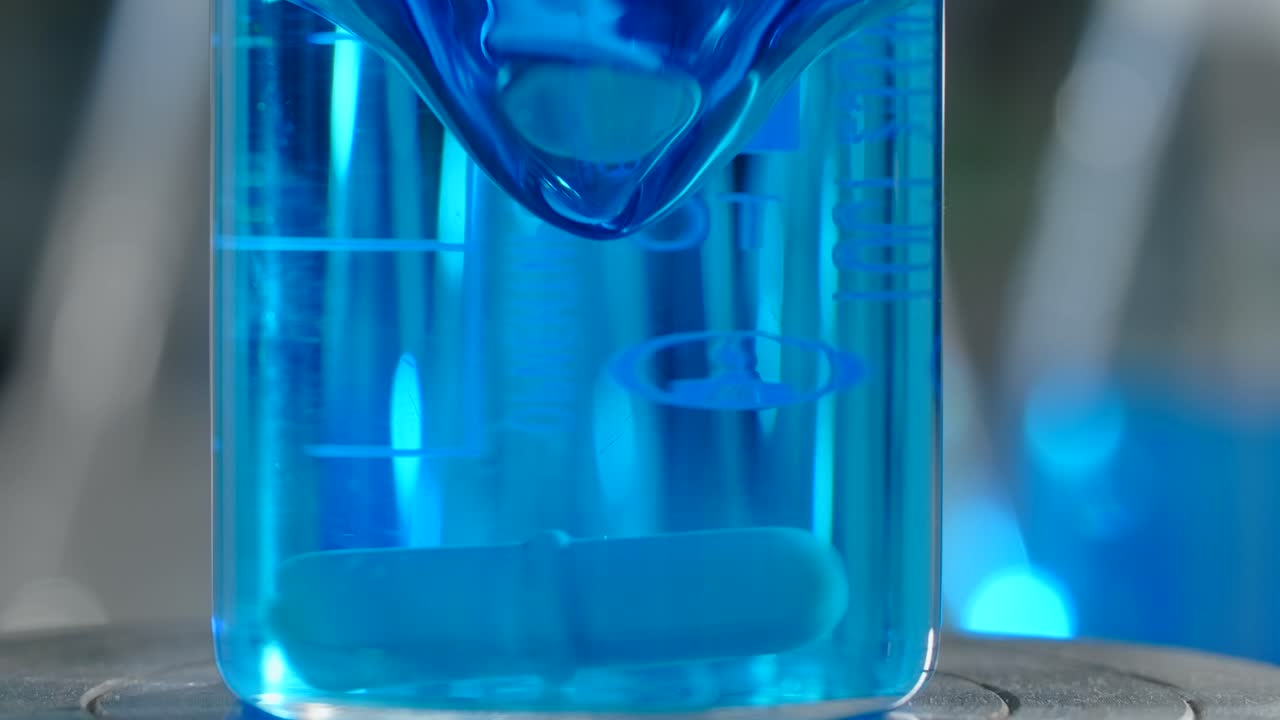 Blue Liquid in Beaker in a Laboratory Setting