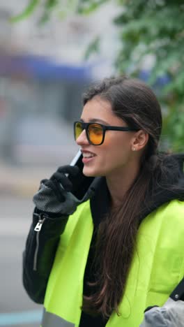 woman street cleaner on phone