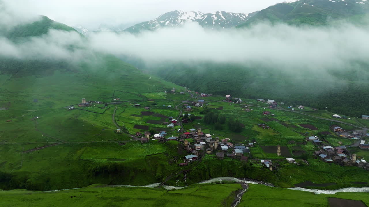 Ushguli Medieval Village Over Enguri Gorge During Sunrise In Svaneti, Georgia. Aerial Drone Shot