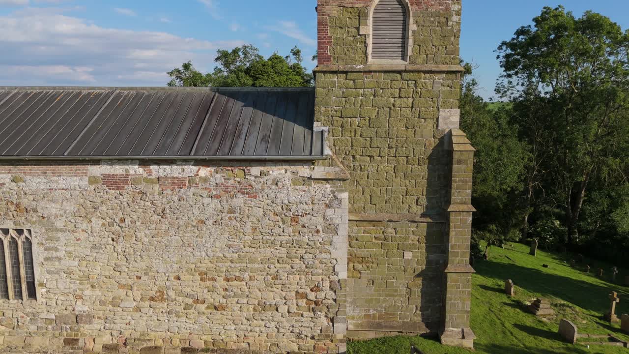 Quaint rural village church is a small, picturesque rural setting. St Mary's Church on the High Street of Burwell a peaceful atmosphere, beautiful natural landscapes, rolling hills. Rooftop views