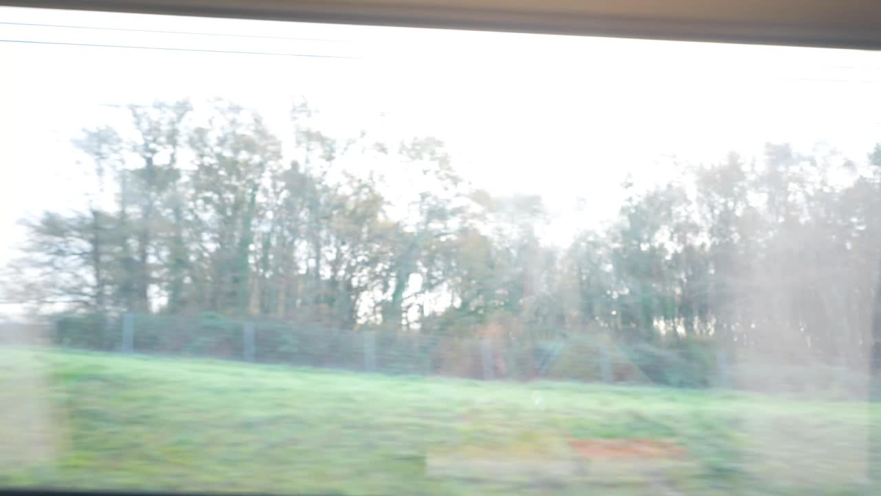 Man traveling by train using a tablet