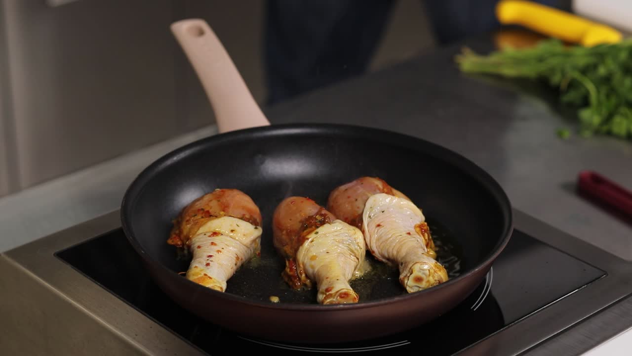 Frying Chicken Drumsticks in a Pan