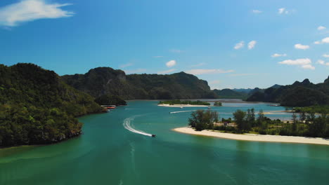 stunning drone footage of two tourist boats sailing inbetween tropical islands