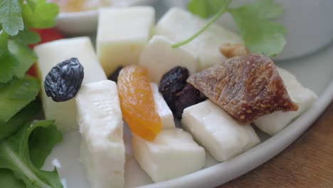 close-up view of a delicious cheese and dried fruit platter