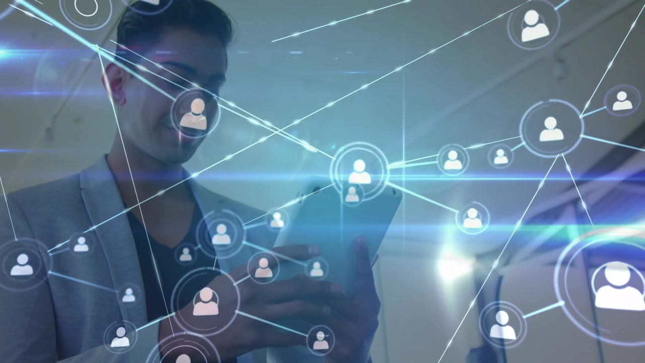 Animation of network of profile icons against businessman using digital tablet at office