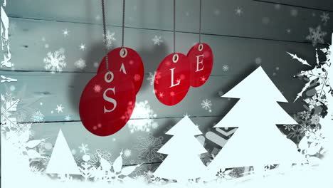 Red-sale-tags-hanging-against-wood-with-festive-decorations