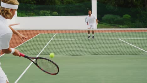 tennis players playing a point