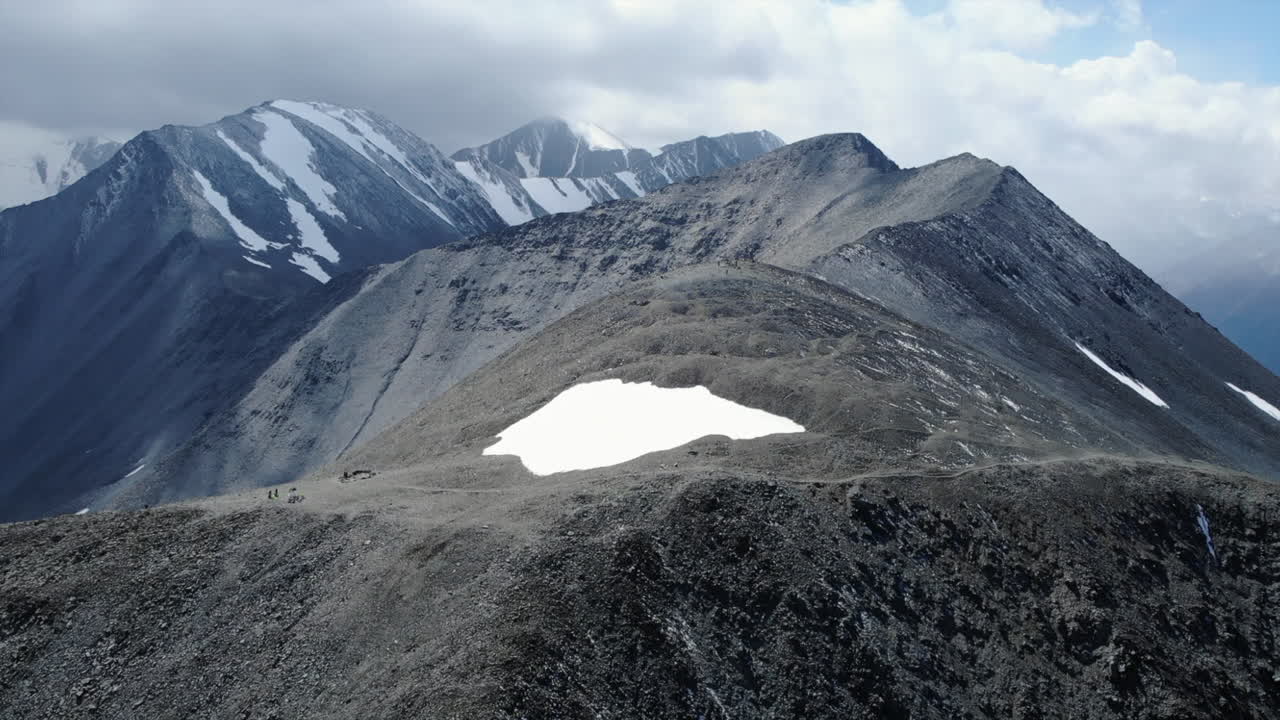 Majestic Mountain Range with Snow-Capped Peaks and Rocky Landscape