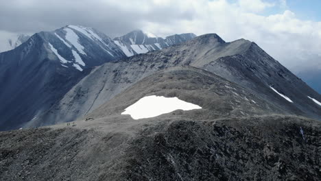 majestic mountain range with snow-capped peaks and rocky landscape