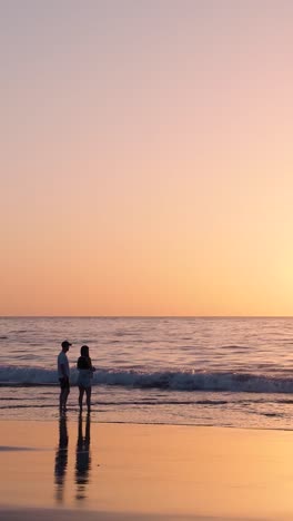 couple watching sunset on the beach