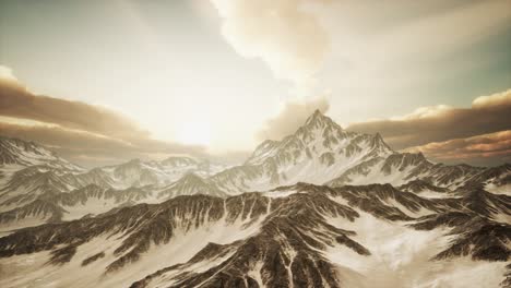 panorama of high snow mountains at sunset