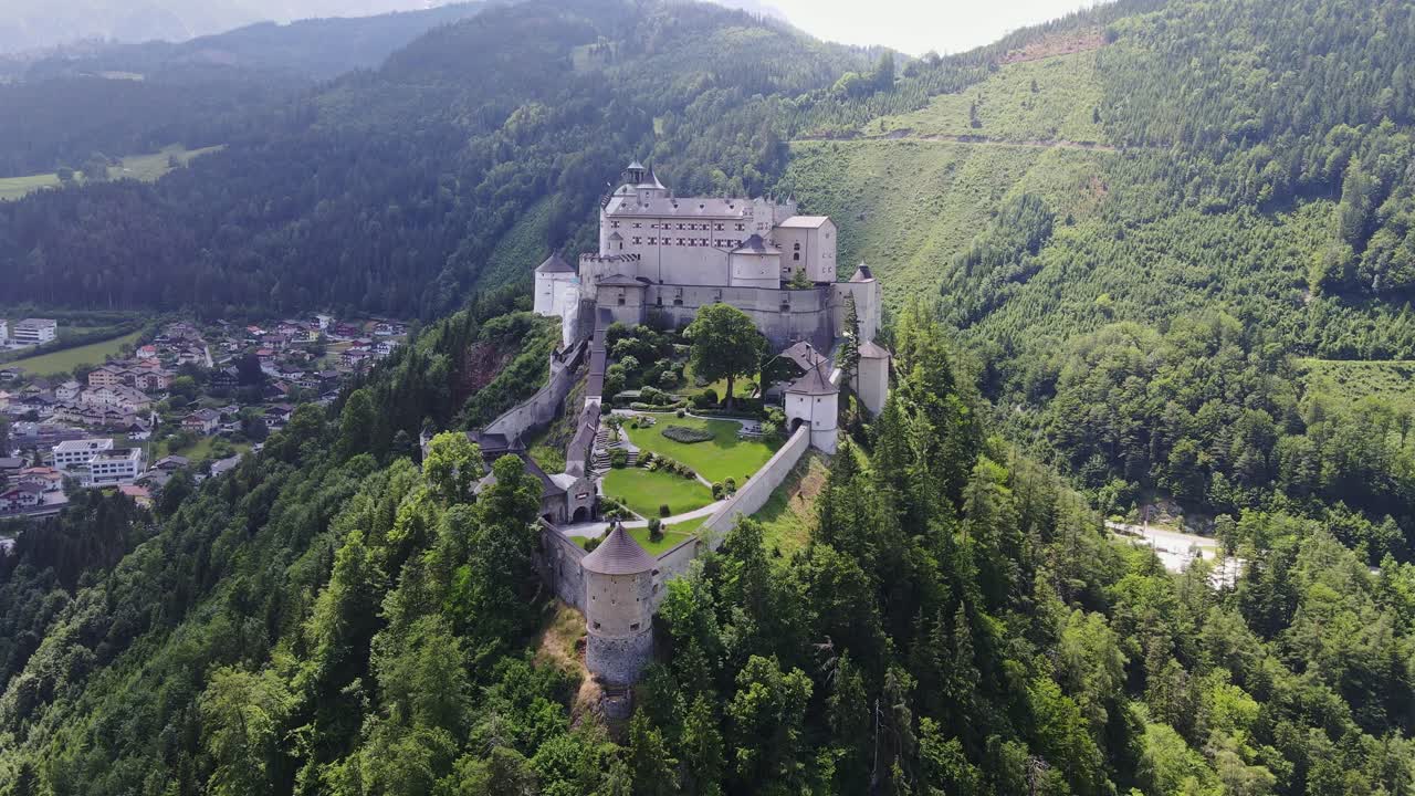 Breathtaking view of Hohenwerfen Castle standing proudly, alpine forest, Austria