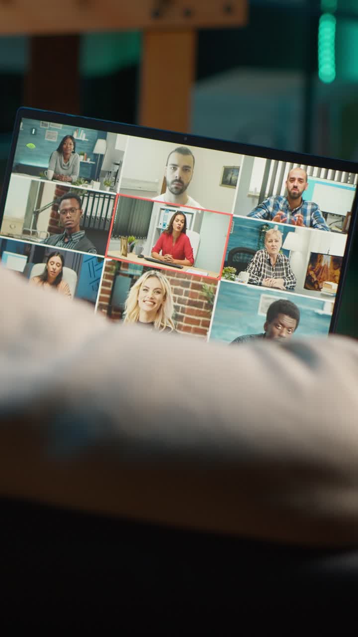 Person Interacting with Laptop Screen Showing Diverse Video Conference