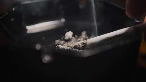 Close-up-smoking-cigarette-on-man-hand