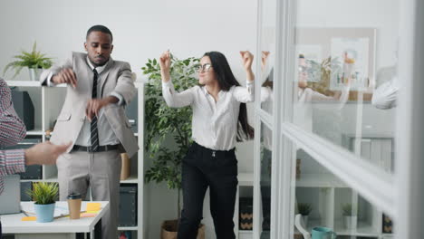 happy office workers dancing