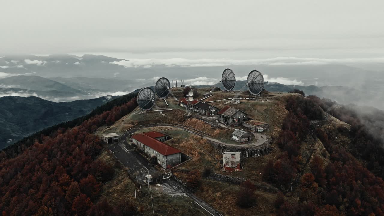 Aerial View of Abandoned Radar Station on a Foggy Mountain