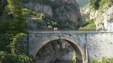 bridge in amalfi coast with beach in background