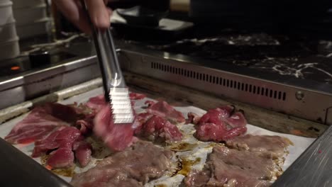 you can see someone to deposit beef on a bbq korean grill with a tool
