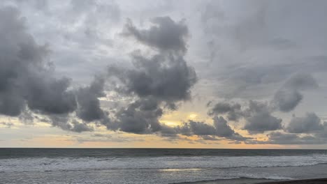 small waves in the ocean of indonesia under the cloudy sky