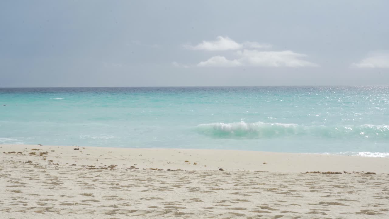 Calm Sea Waves in Cancun with beautiful blue waters. Caribbean Beach.