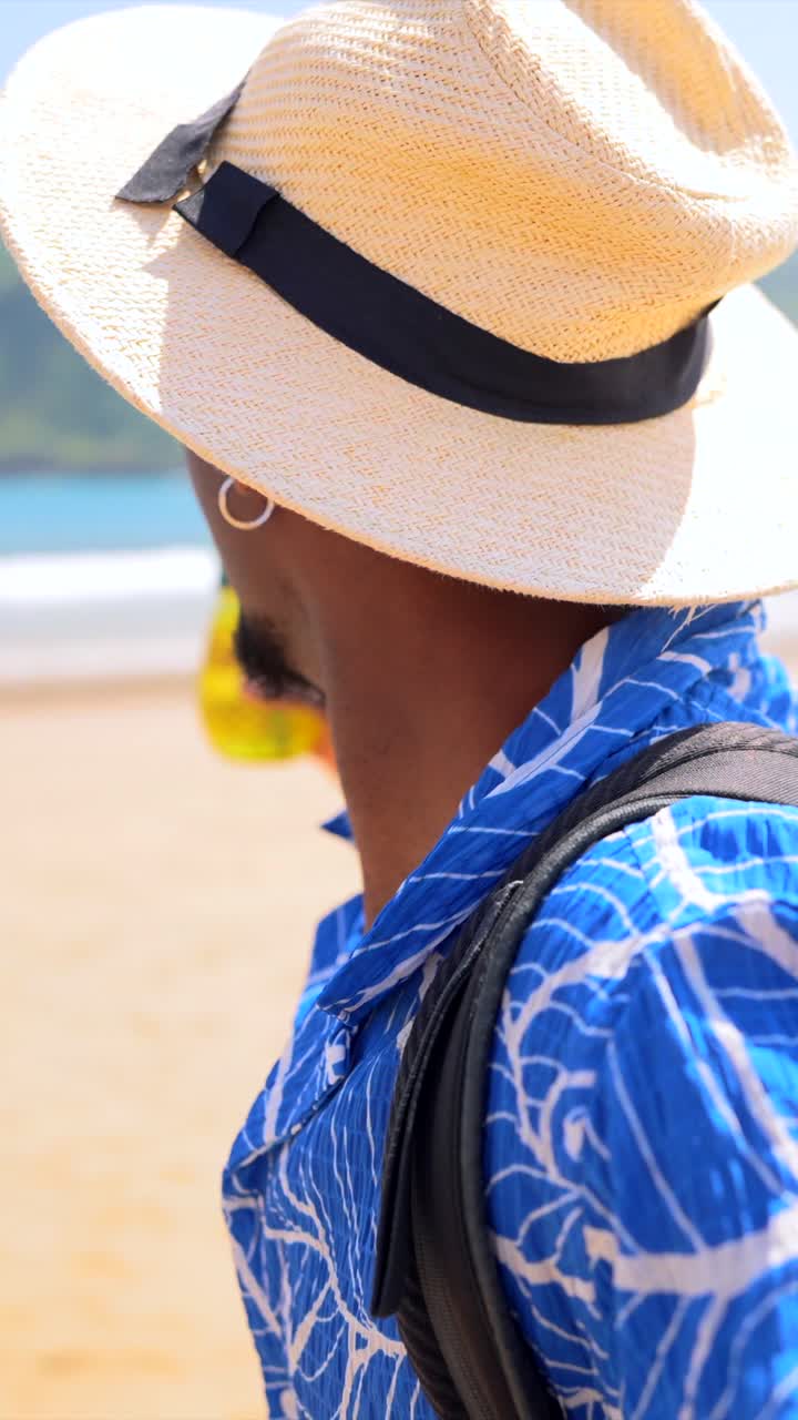 Man enjoying a tropical vacation on the beach