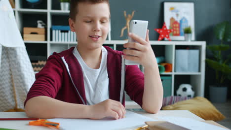 boy using smartphone in a room