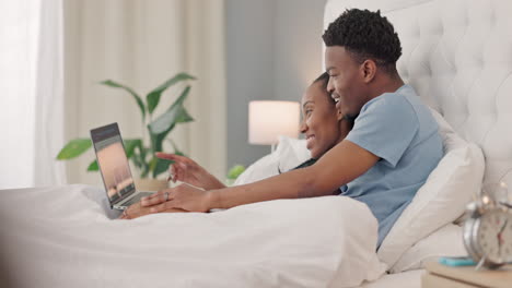 Black-couple,-watching-movie-and-laptop