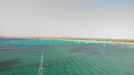 Spain,-Mallorca-Platja-des-Trenc-beach-a-beautiful-fly-by-over-the-beach-at-4k-24-fps-with-ND-filters-on-a-very-bright-day-with-a-DJI-Mavic-Air-drone