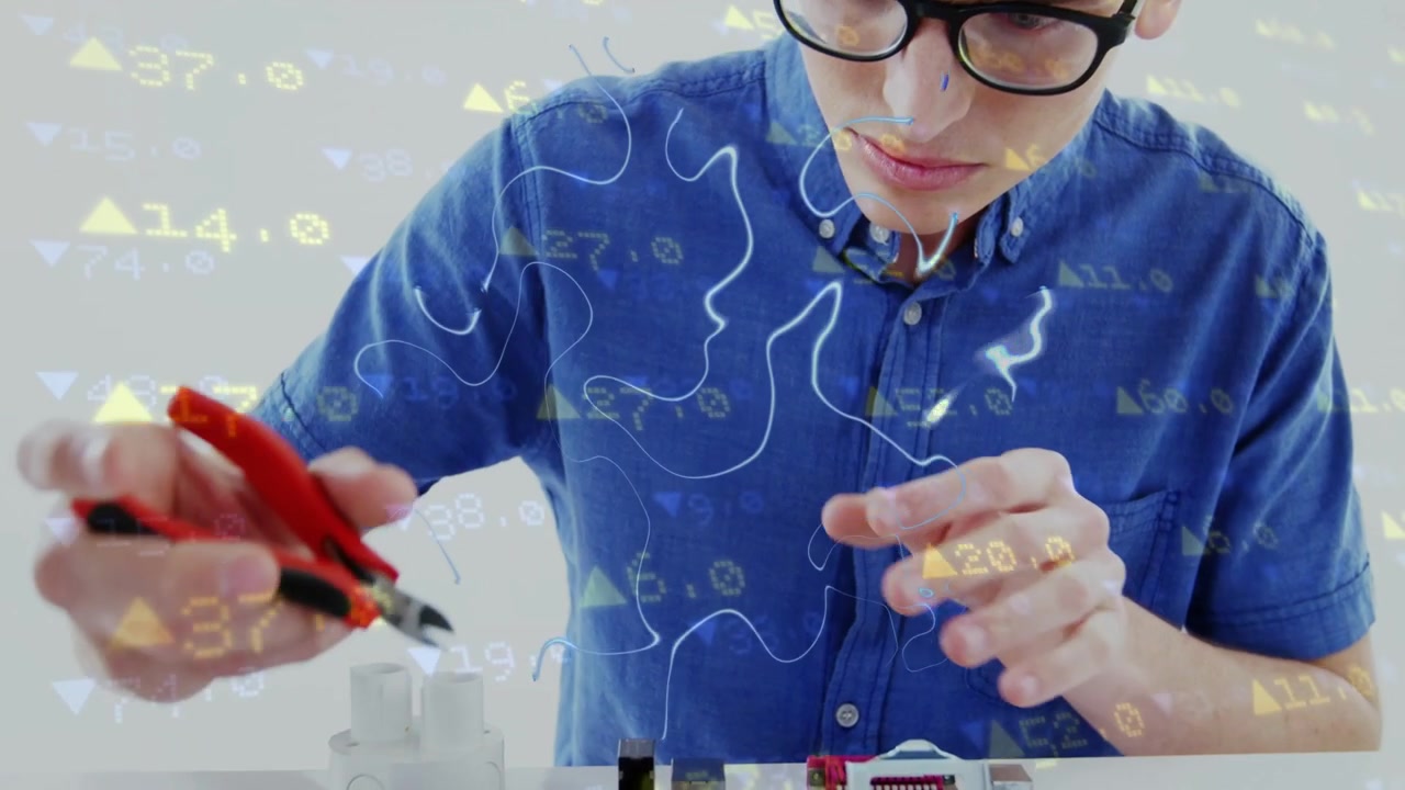Overlay appearing, technician picking parts, trimming leads with pliers, ensuring board connections