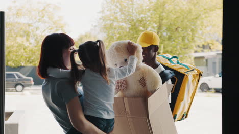 delivery person with package at home