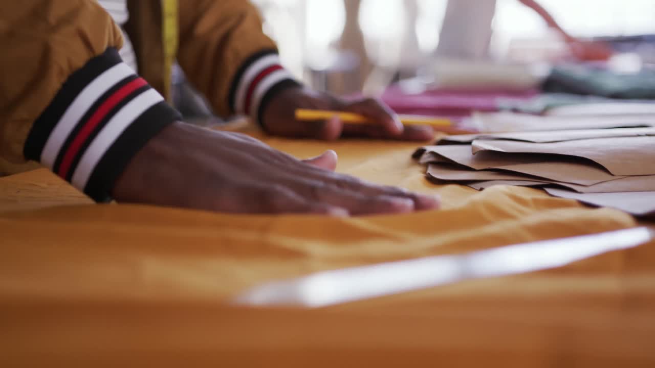 Mixed race man working in fashion office