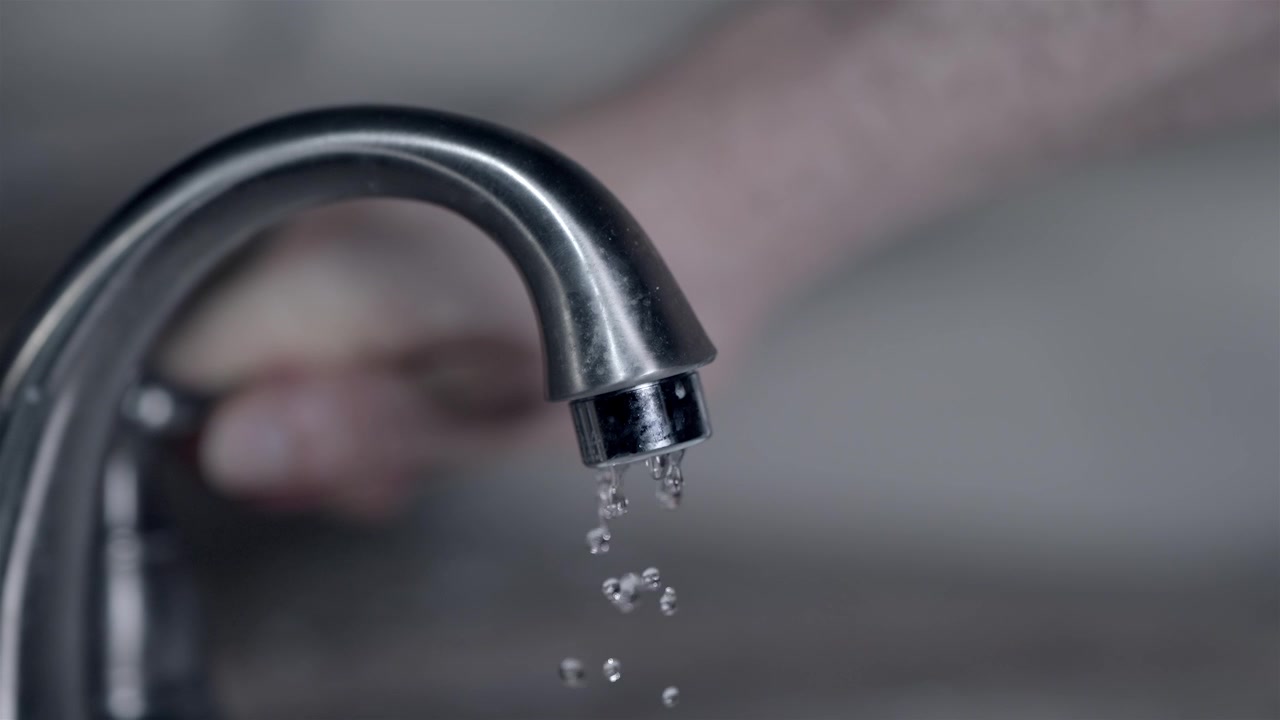 Running water from chrome faucet after successful home plumbing repair