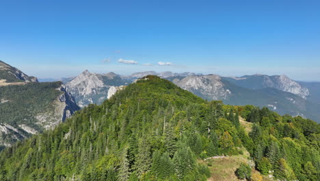 Flight-over-grass-covered-mountain-plains