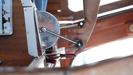 hand operating a boat throttle