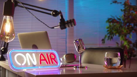 on air podcast studio setup with microphones and laptop