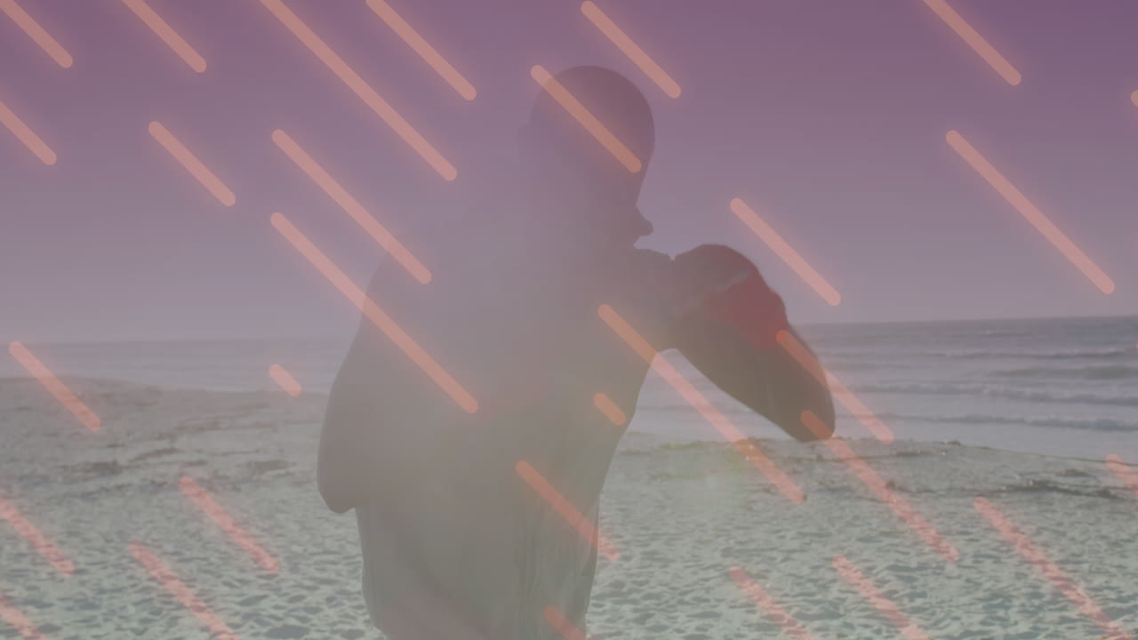 아프리카계 미국인 남자가 해변에서 주먹을  ⁇ 는 선의 애니메이션