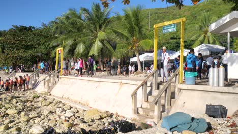 tourists preparing for a whale shark watching experience in oslob, cebu, philippines - wide shot