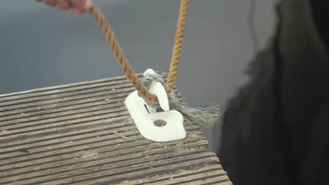 tying the bowline on the dock cleat