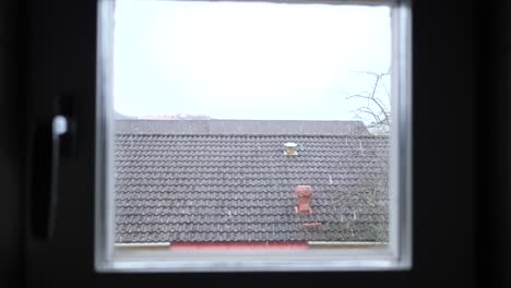 slowly paning to window where outside there is snowing
