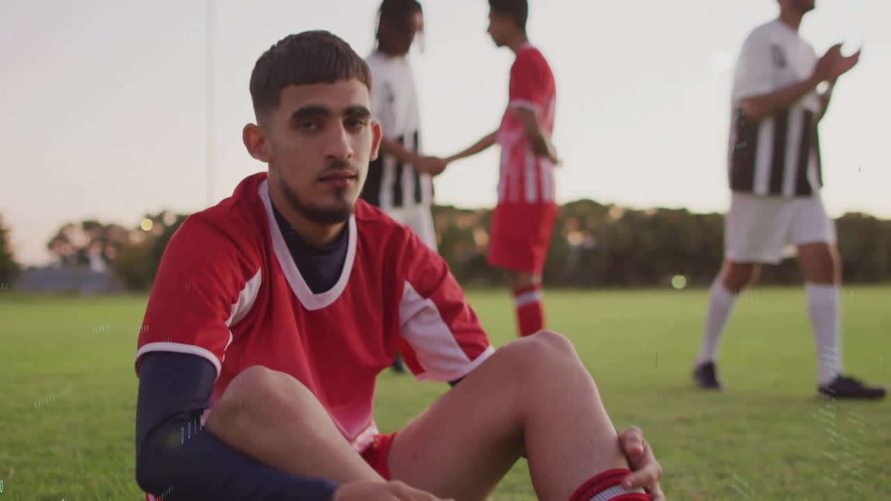 soccer player sitting on grass, showing floating heart icon and chart, measuring fitness for health