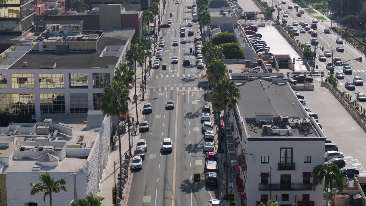 Aerial Flyover Of Cars Driving On South Santa Monica Blvd In Beverly Hills, Los Angeles.