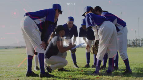 in blue uniforms, baseball team huddling around coach with clipboard on field